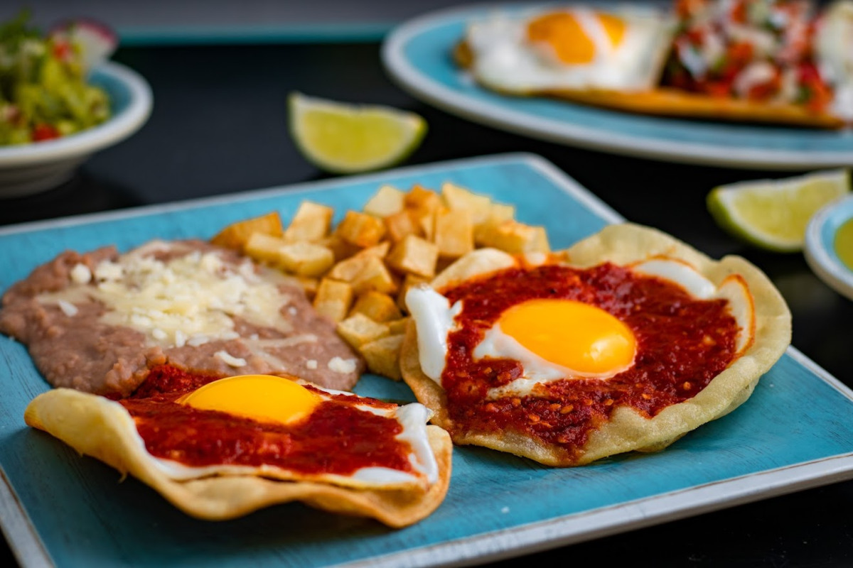 Pastry with dip and fries eggs, rice on the side